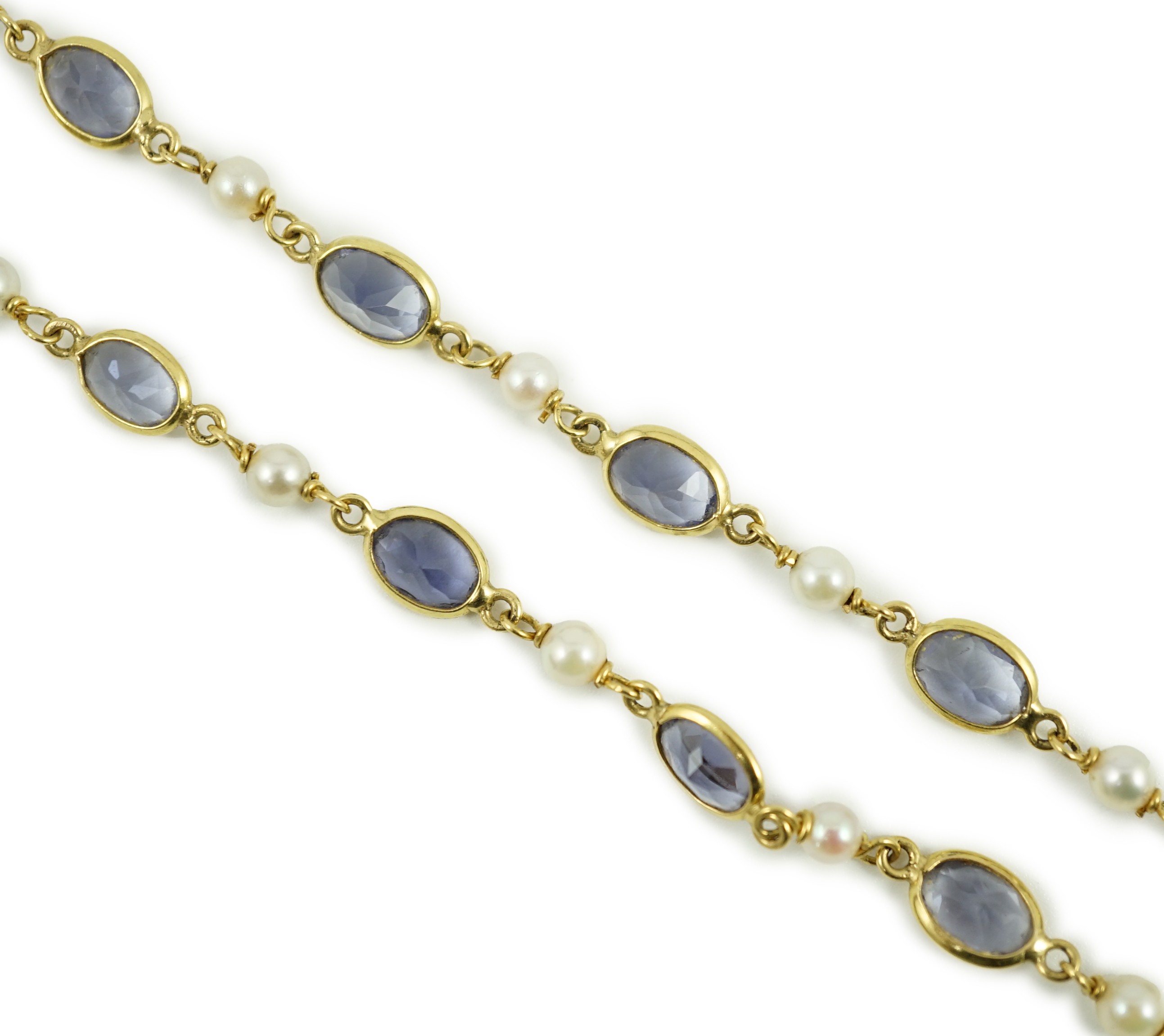 A modern 18ct gold, blue quartz and cultured pearl set spectacle necklace, 58cm, gross weight 15 grams.